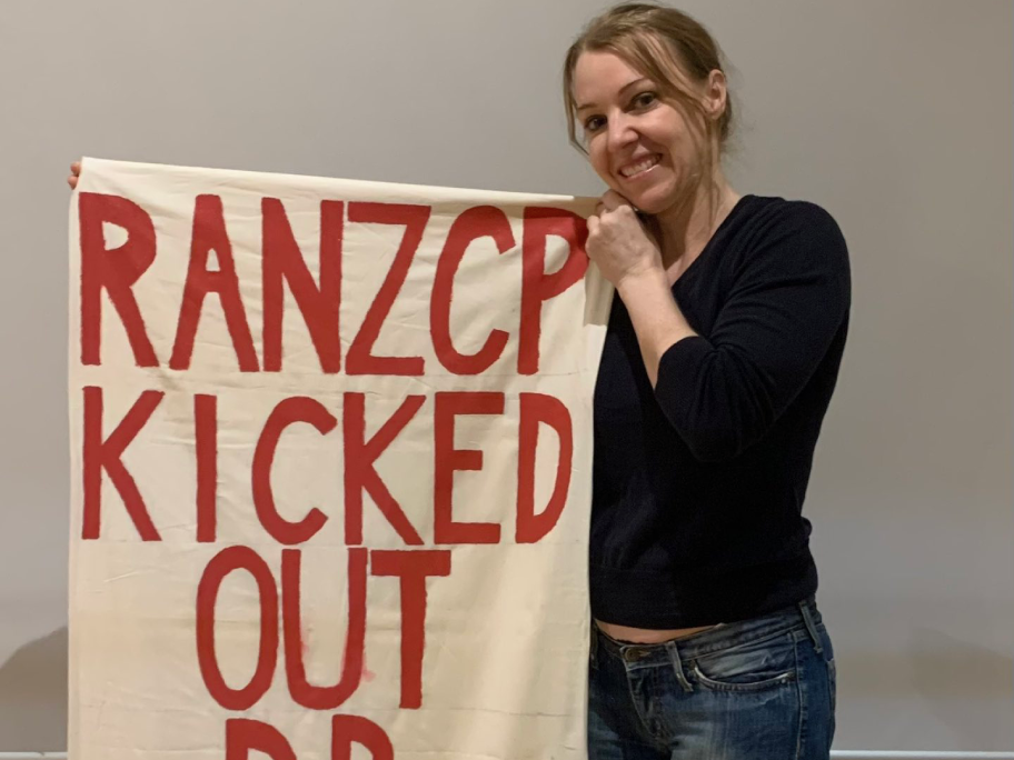 Dr Jillian Spencer with her banner. Photo: X.
