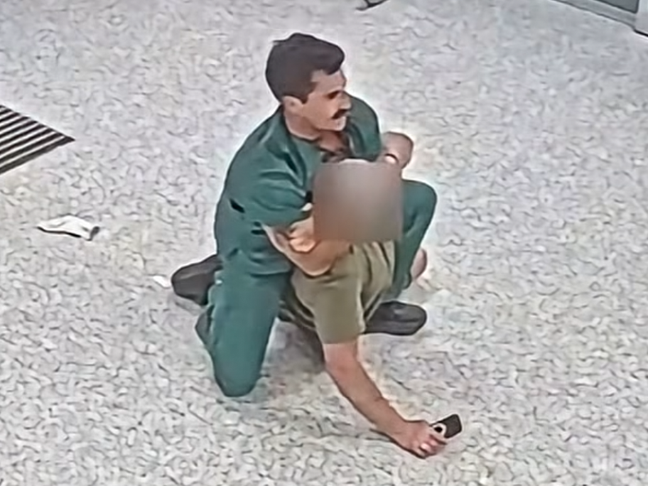 CCTV footage of nurse Daniel Nelson restraining an aggressive patient.